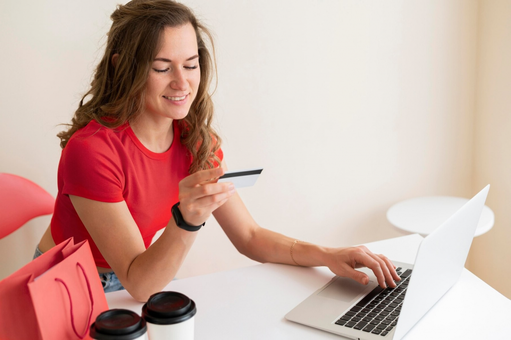 woman shopping online with a credit card